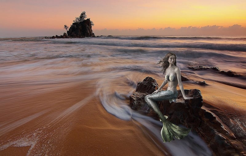 Mermaid Water Feature at Night